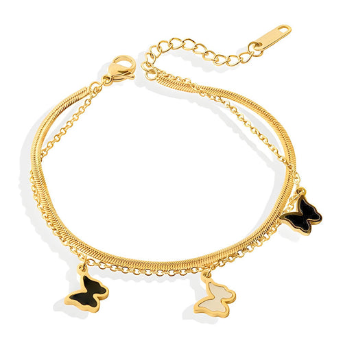 Gold bracelet with butterfly charms on a white background