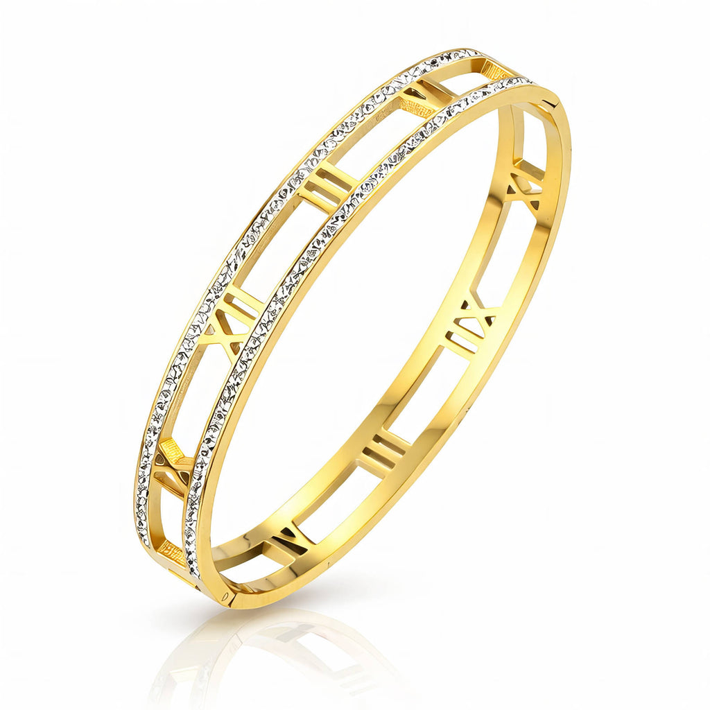 Gold bracelet with diamond accents on a white background