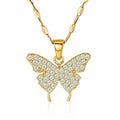 Gold butterfly pendant necklace with clear gemstones on a white background