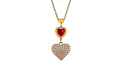 A gold-toned pendant necklace featuring a small red heart charm and a larger heart-shaped pendant paved with clear rhinestones